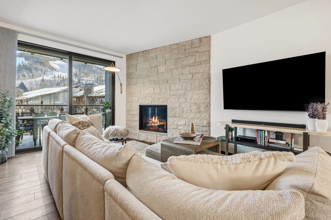 The Lion living room with fireplace and ski views